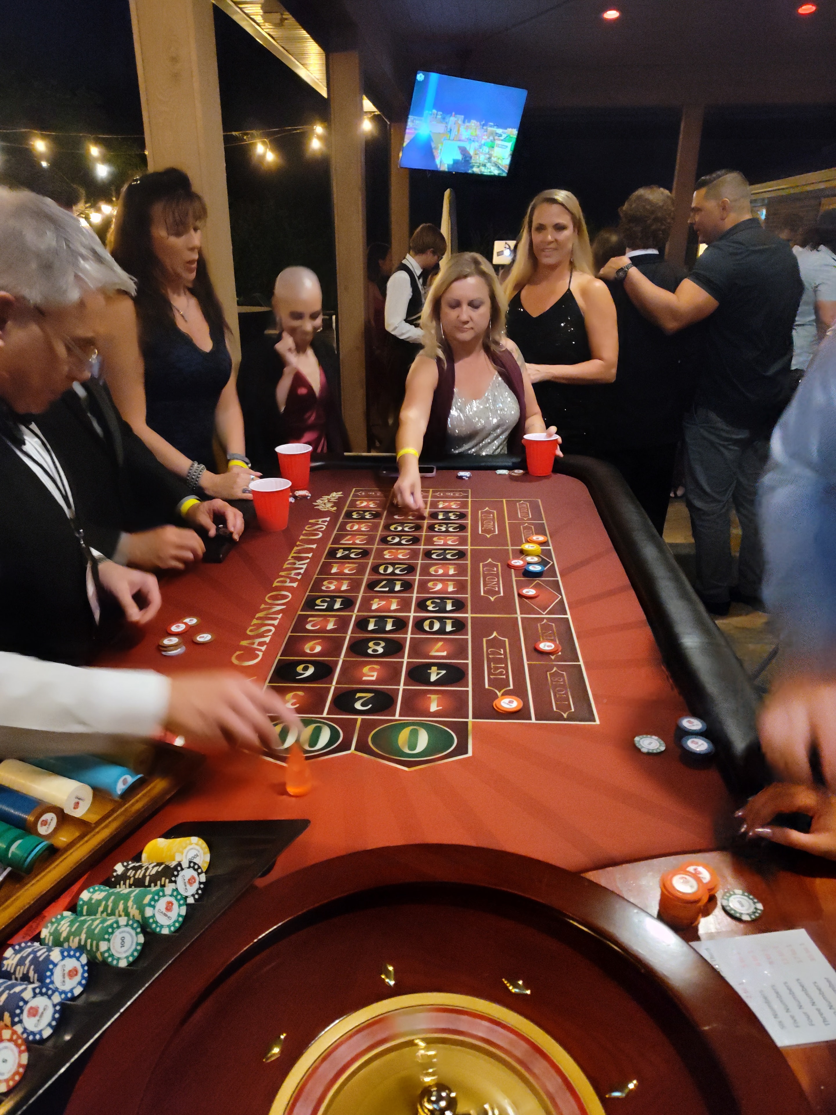 Guests at a Casino Party USA roulette table at a Cheyenne event