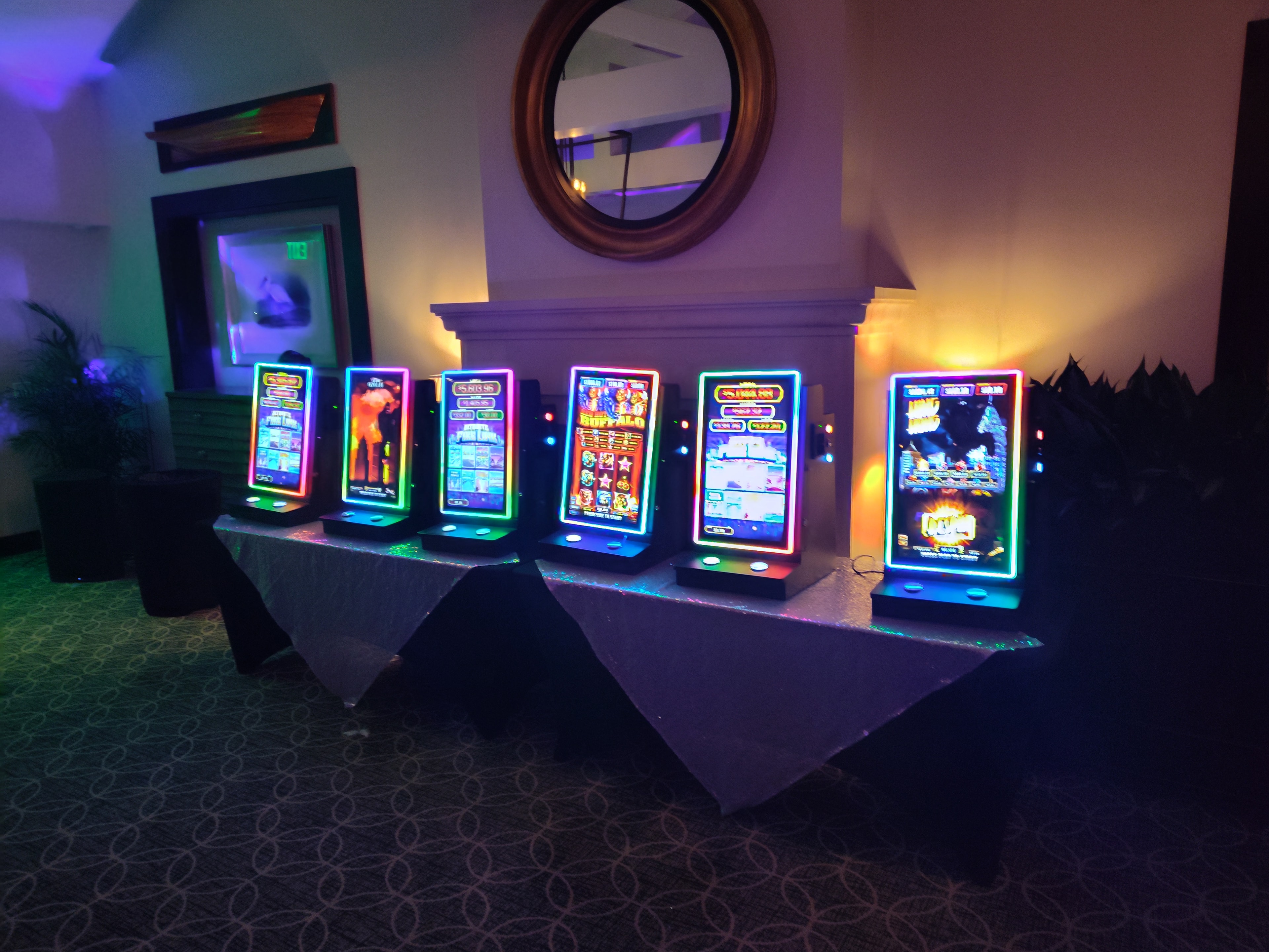 Neon-lit slot machines on display at a Casino Party USA event in Cheyenne