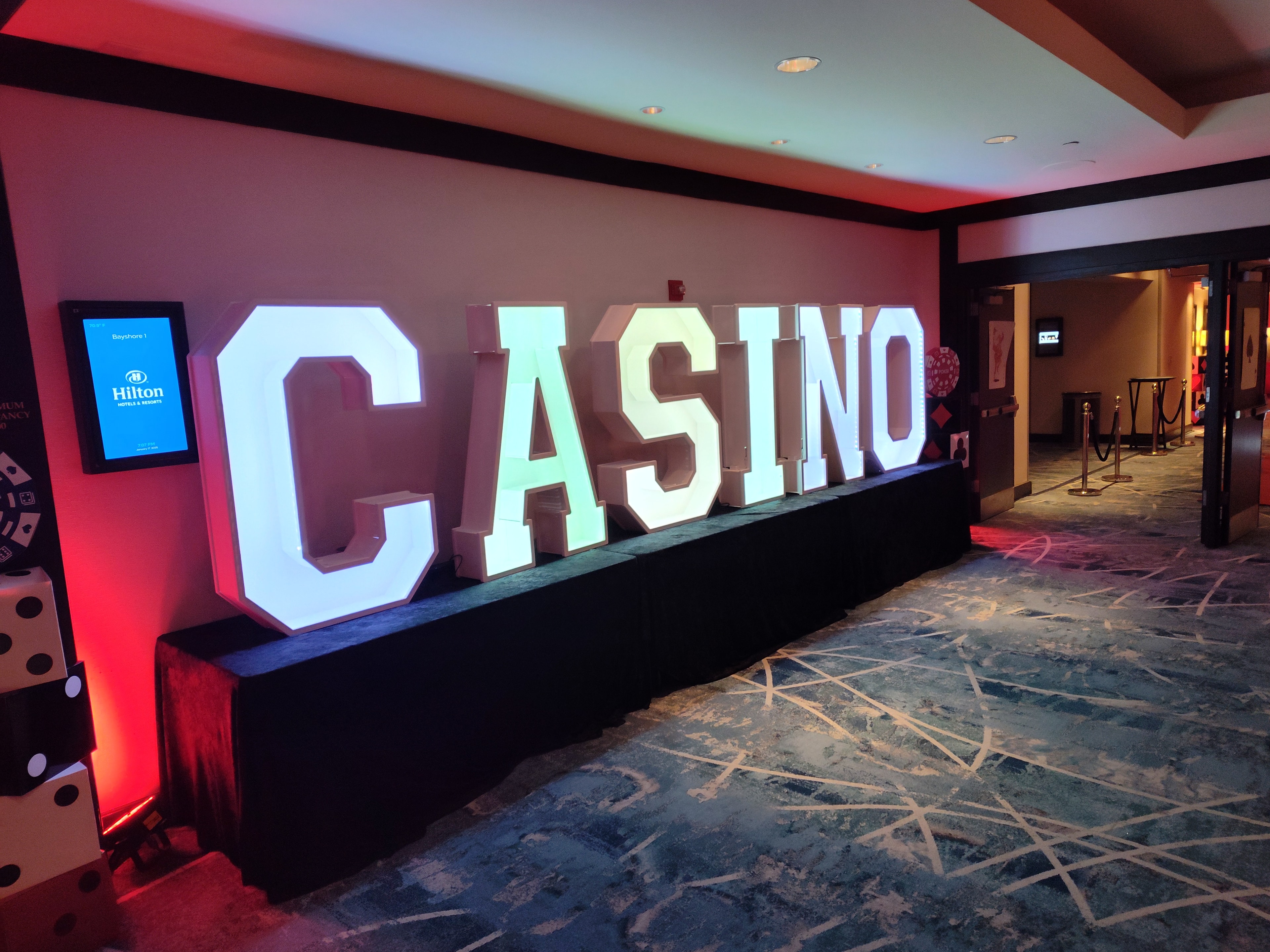 Casino party decorations — illuminated CASINO marquee letters