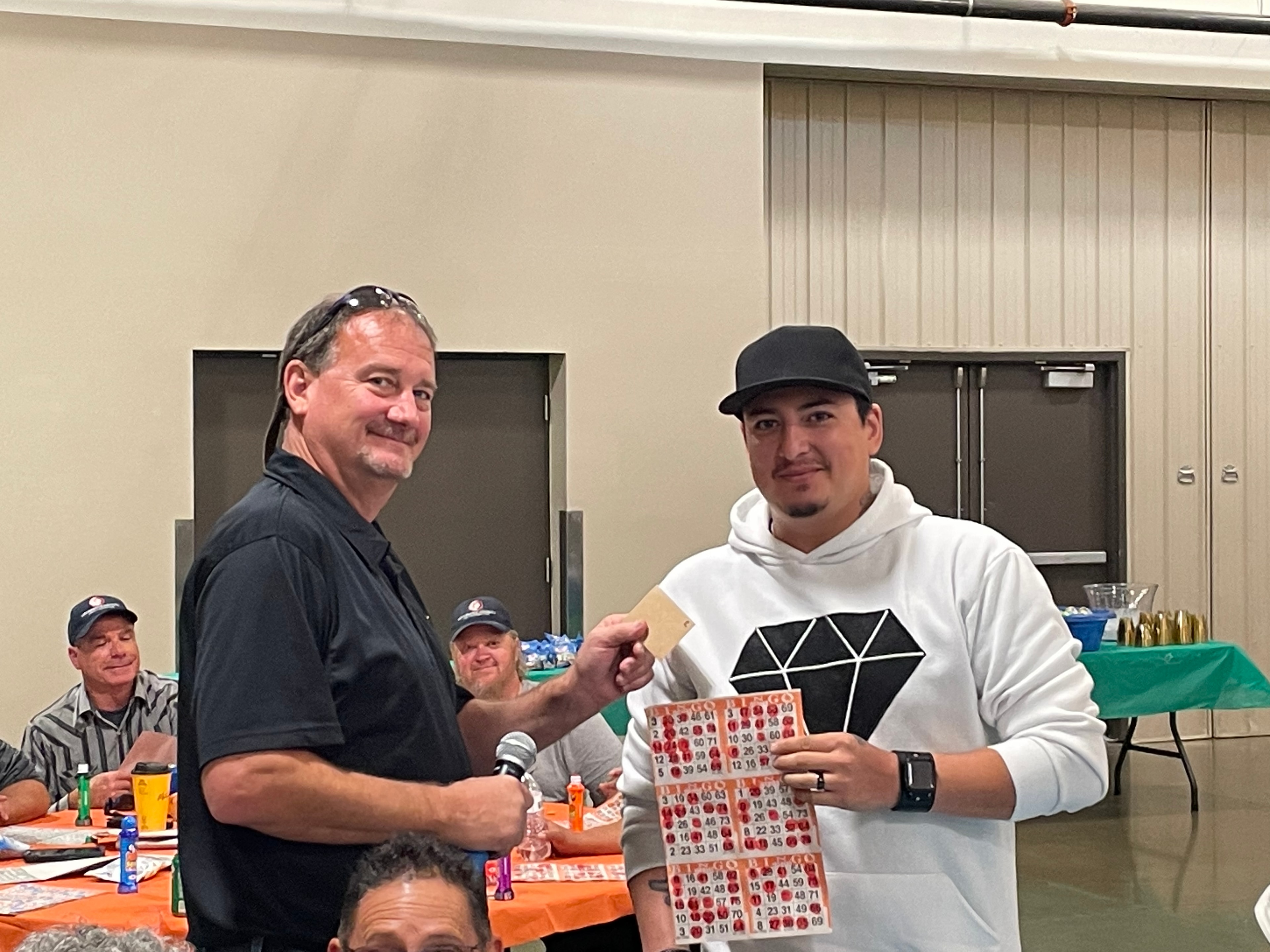 Bingo winner receiving prize at a Casino Party USA event