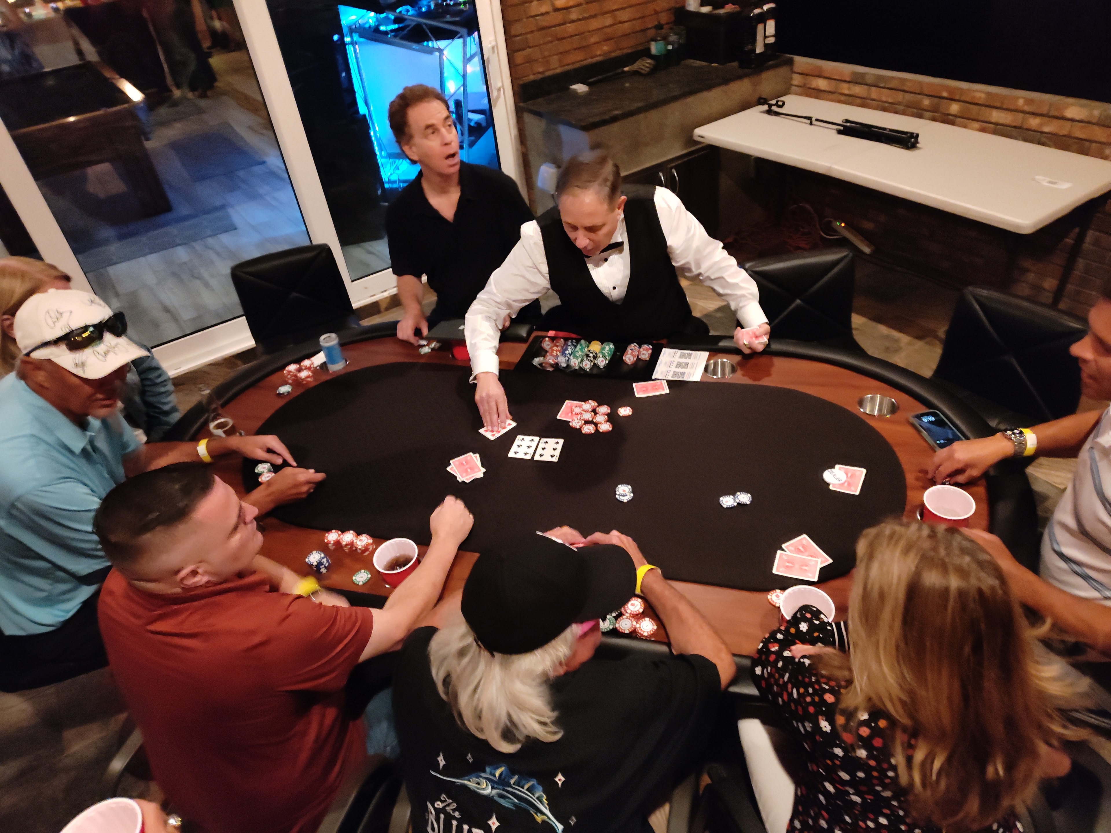 Guests playing poker at a Casino Party USA fundraiser event