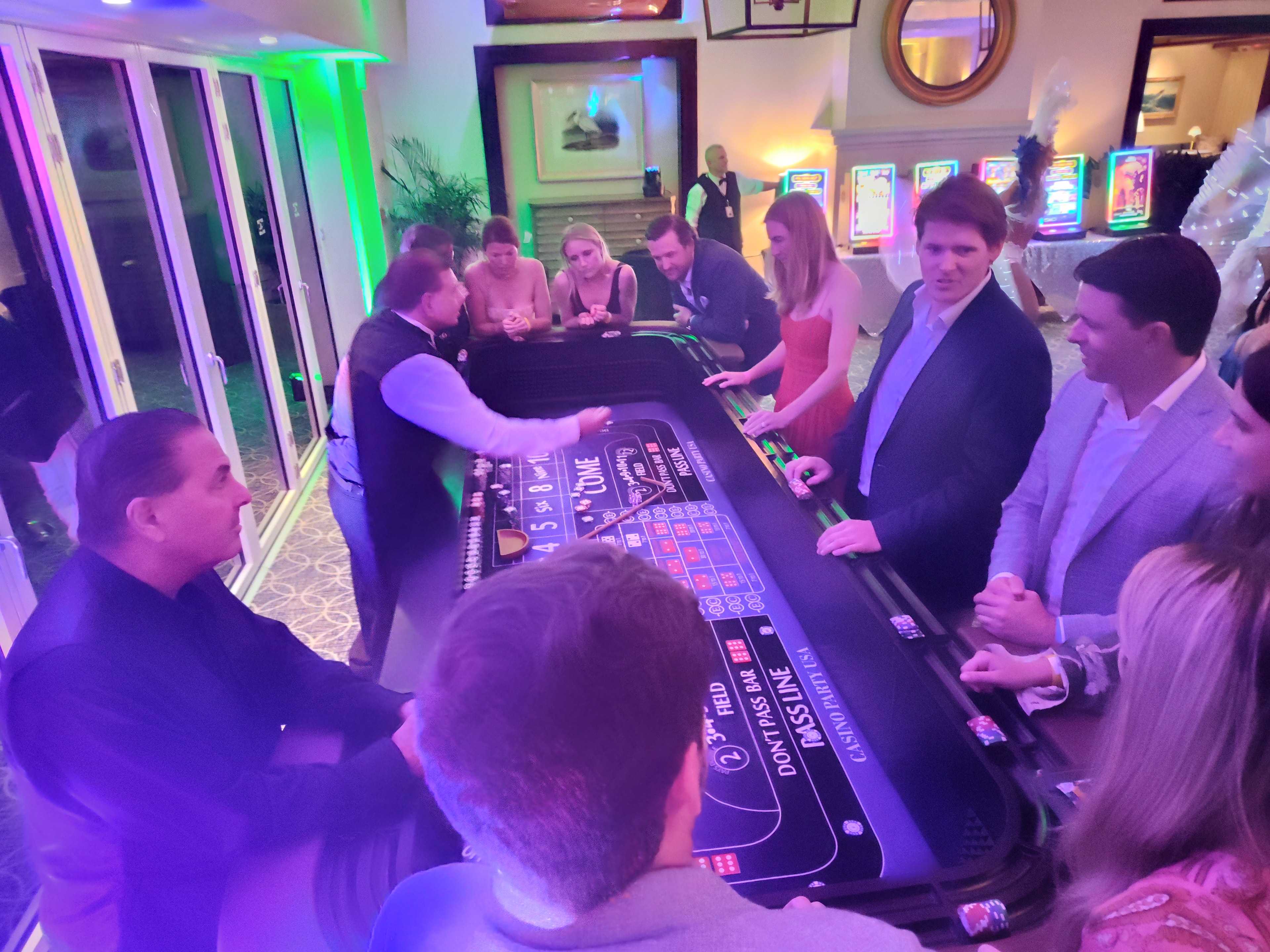 Guests at a Casino Party USA blackjack table at a fundraiser event