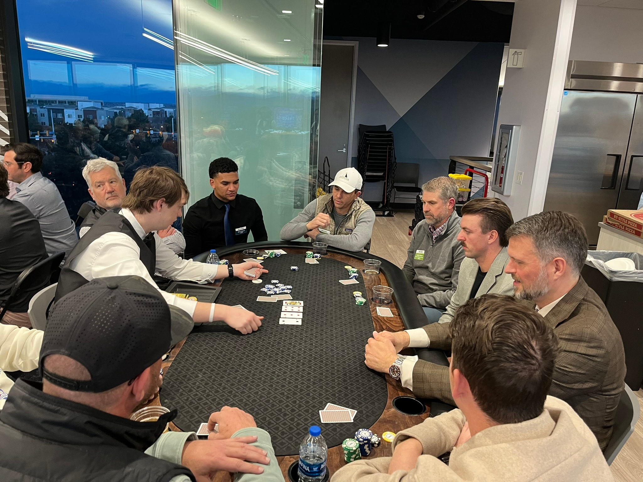 Team building casino activity — guests playing poker at a corporate event