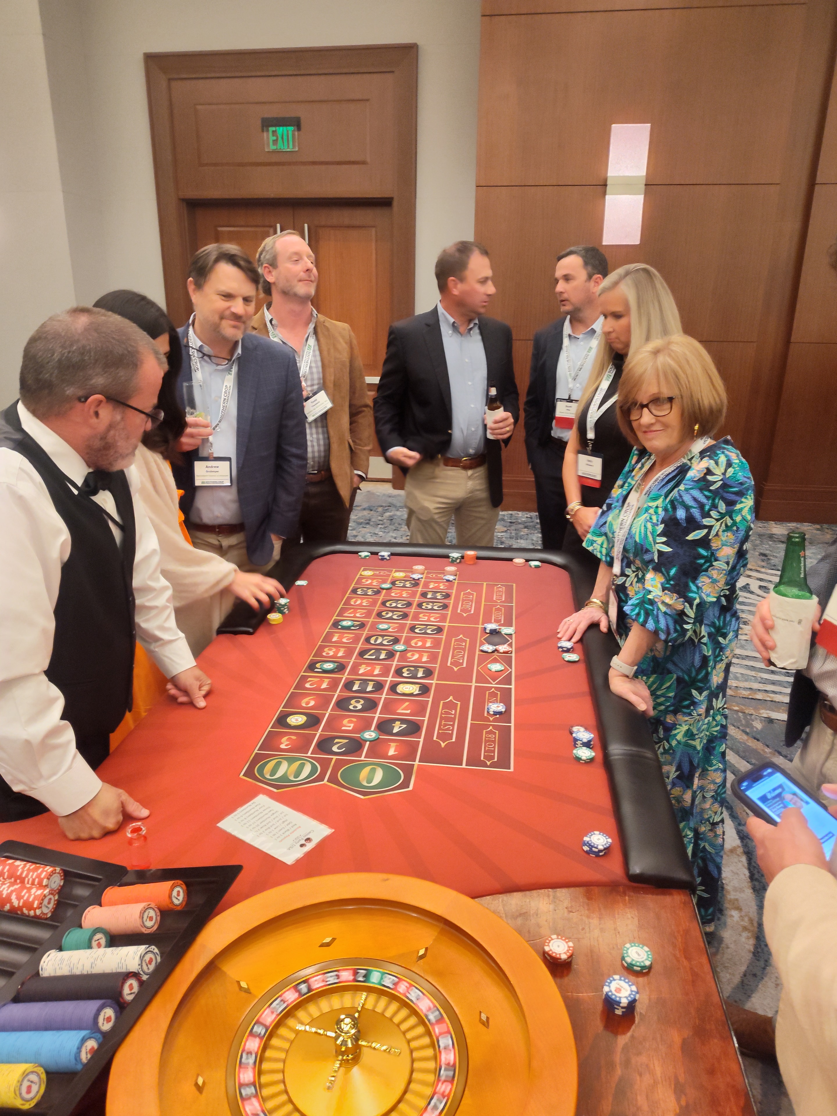 Guests playing roulette at a Casino Party USA table at a Jacksonville corporate event