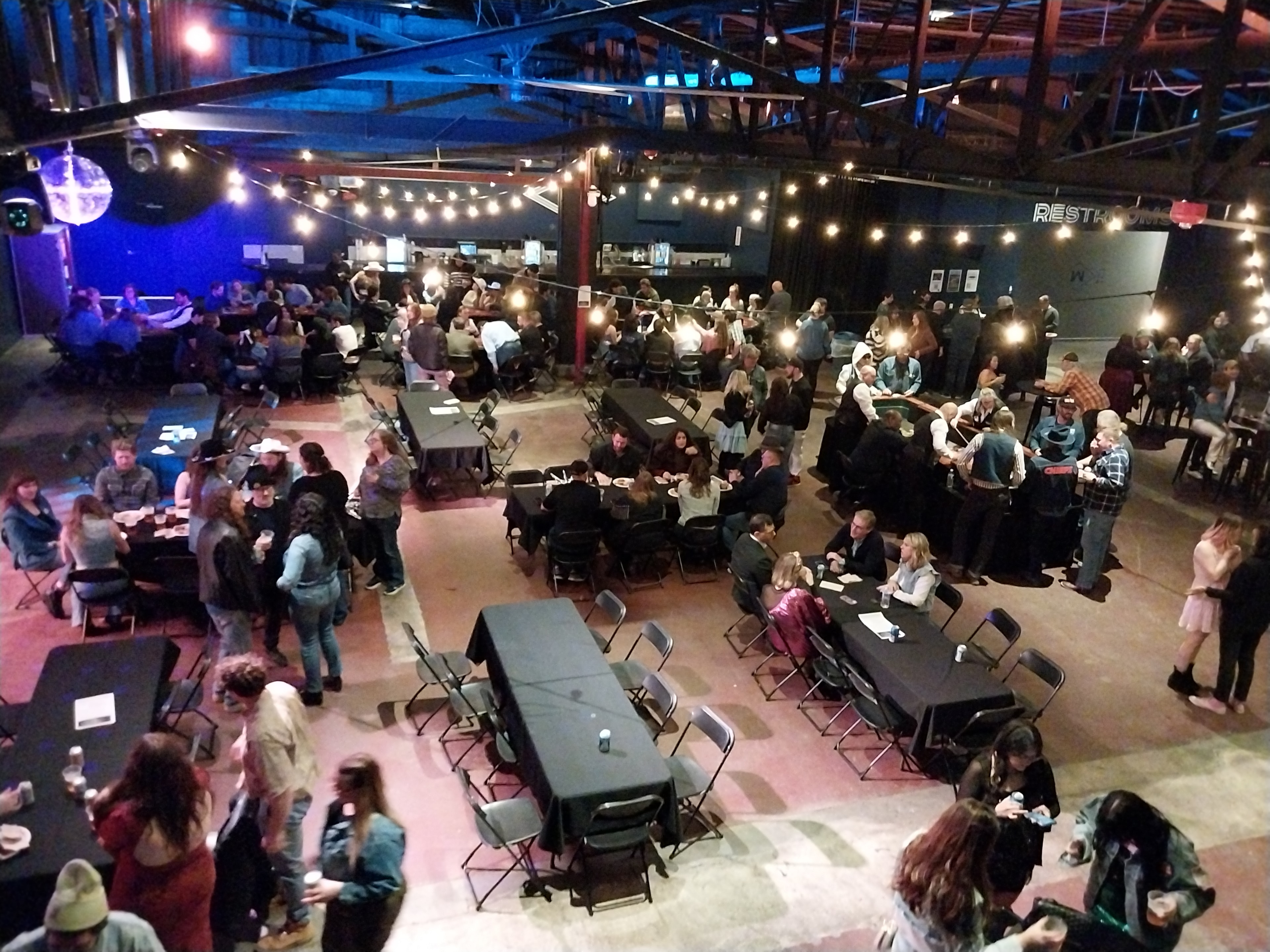 Wide-angle aerial view of a full Casino Party USA event venue in Kansas City