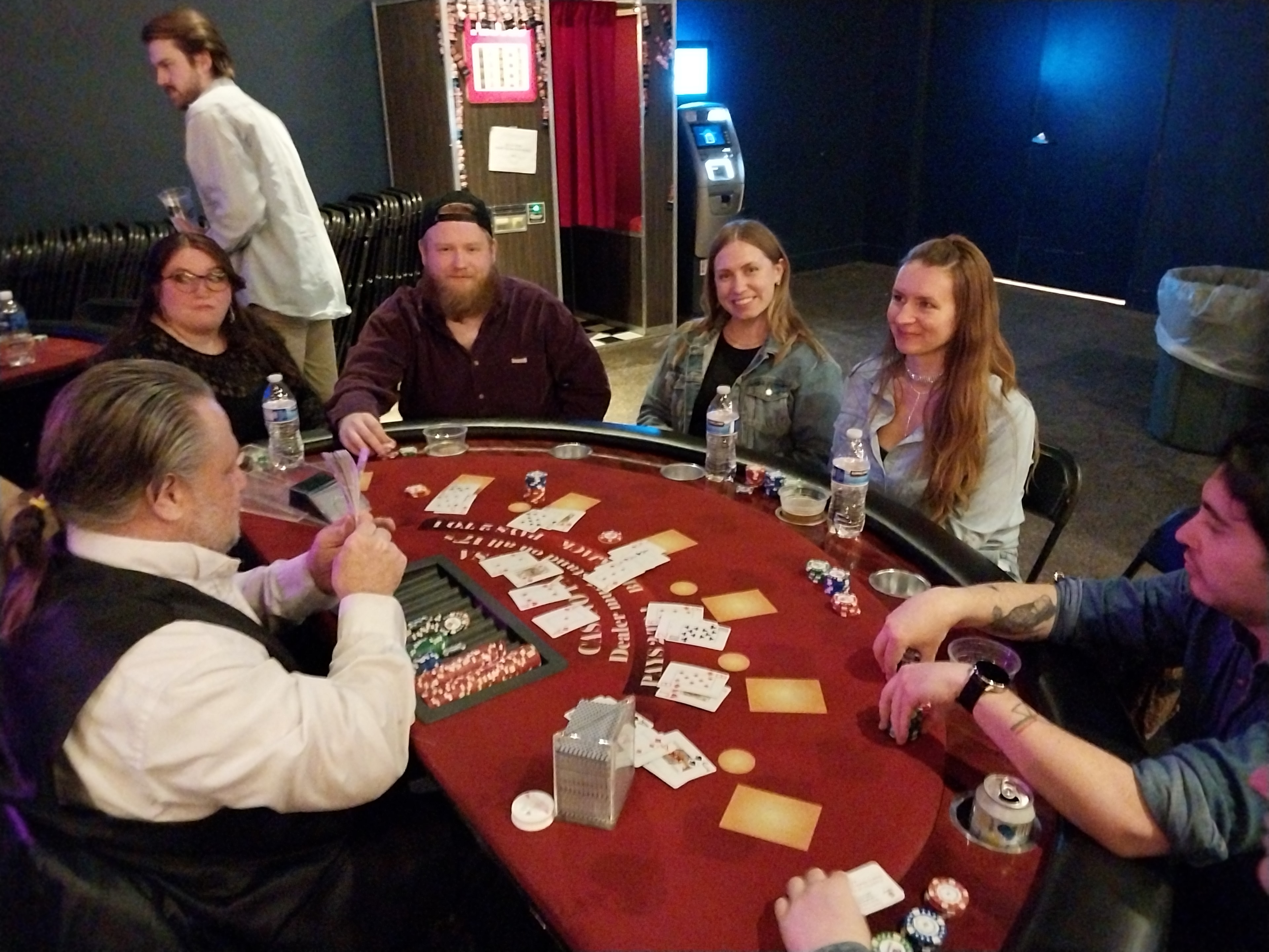 Dealer and guests at a Casino Party USA blackjack table in Kansas City