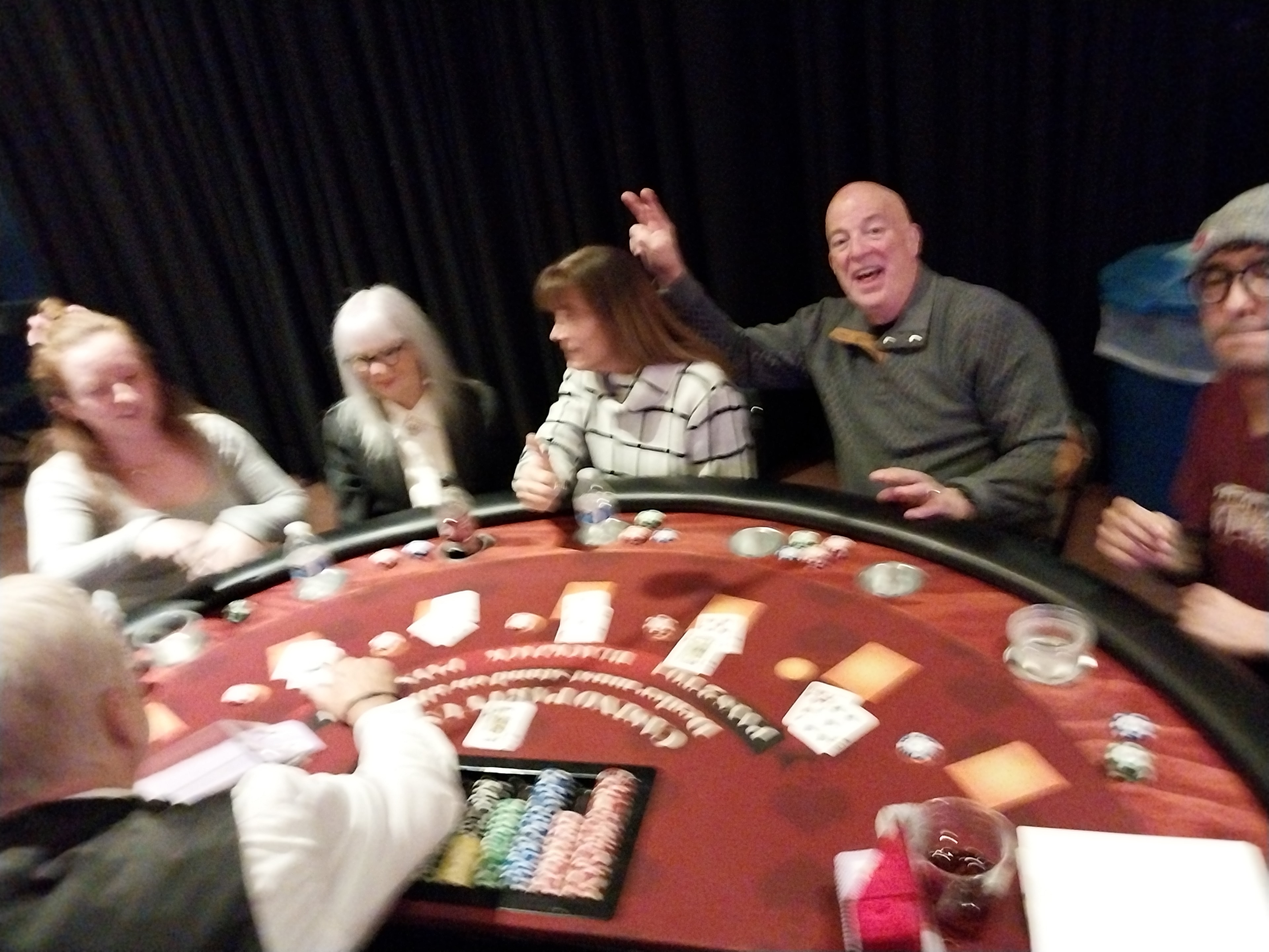Guests celebrating at a Casino Party USA blackjack table in Kansas City