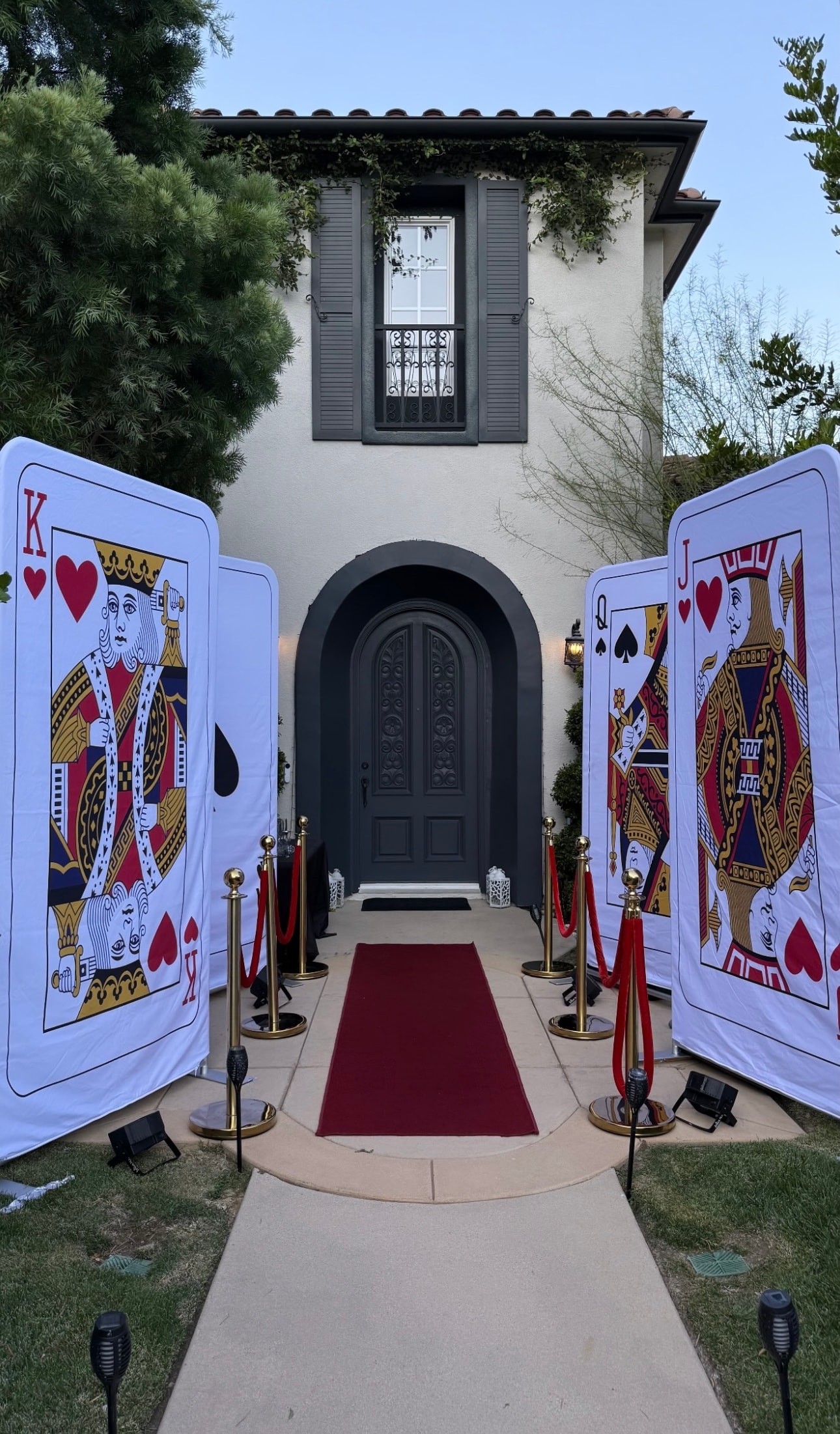 Playing card entrance with red carpet at a Los Angeles casino theme party