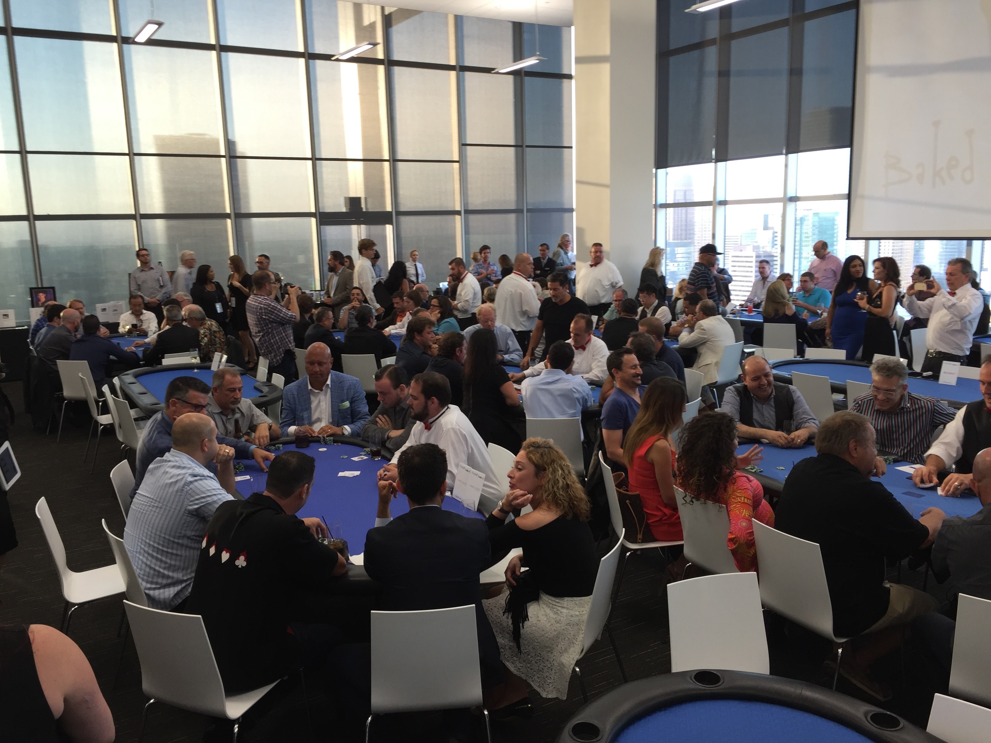 Large poker tournament in a high-rise Los Angeles venue with city skyline views