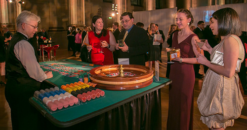 Guests enjoying roulette with dealer at a Northern Virginia Casino Party USA event