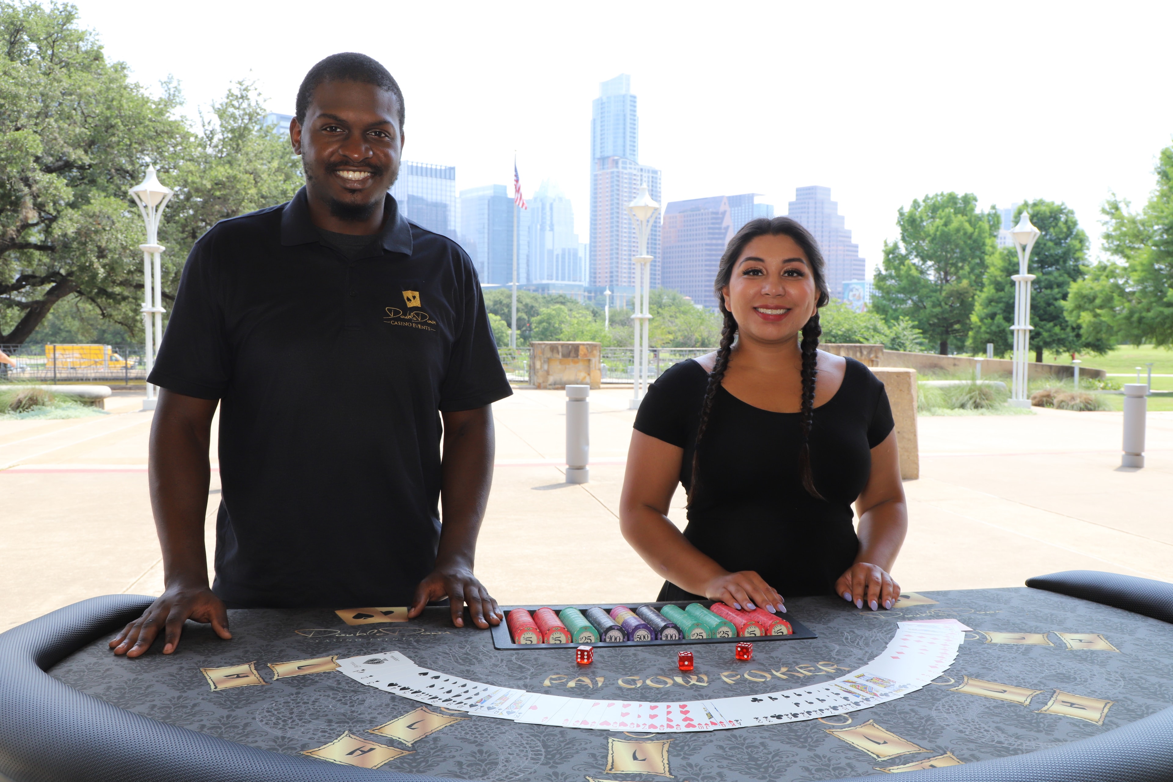 Casino Party USA dealers at a Pai Gow Poker table at a San Antonio event