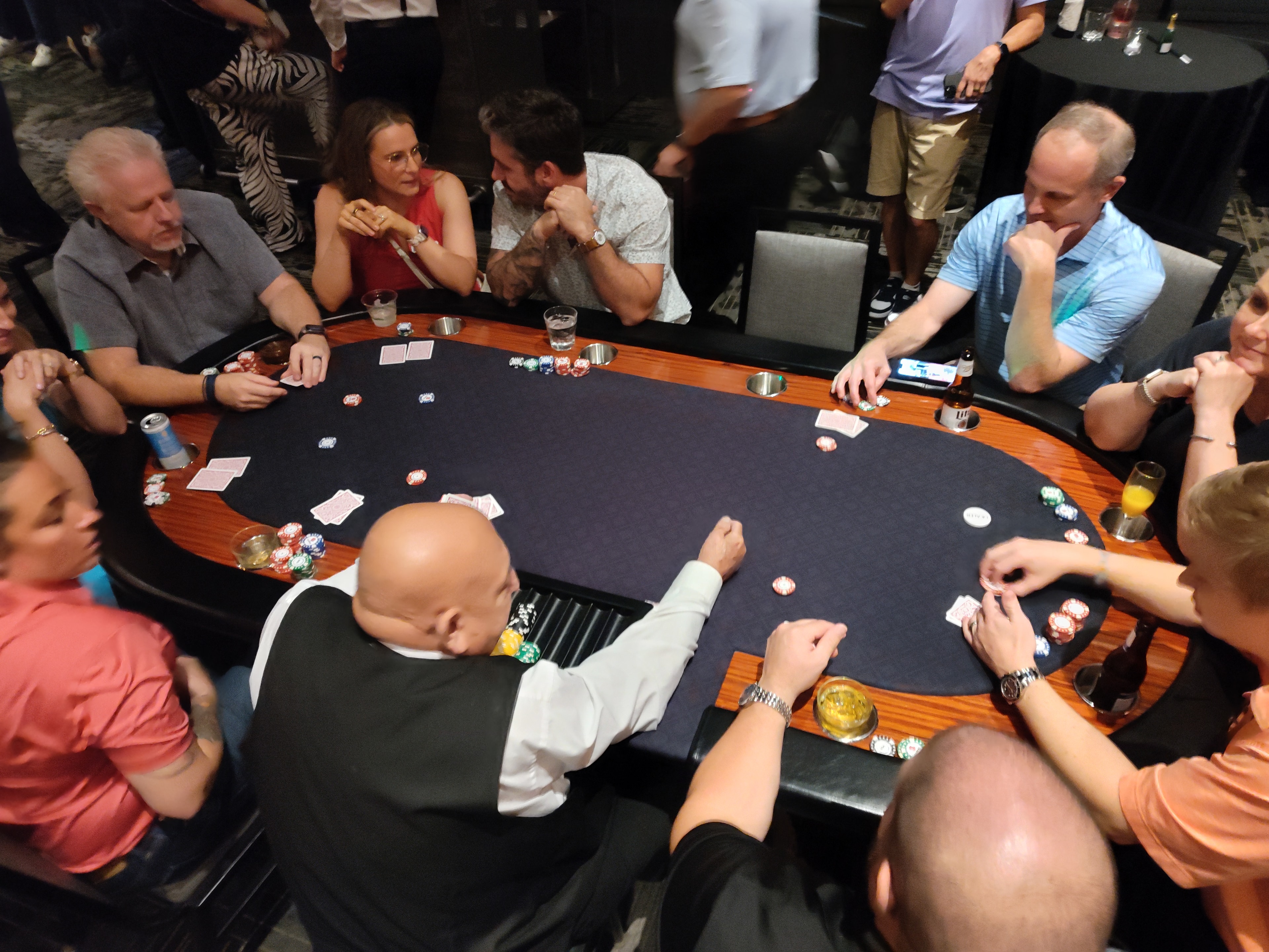 Full Casino Party USA poker table with dealer and guests in casual attire at a Savannah event