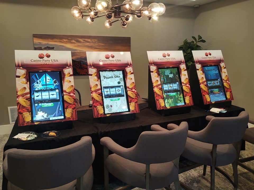 Four Casino Party USA slot machines on display at an event