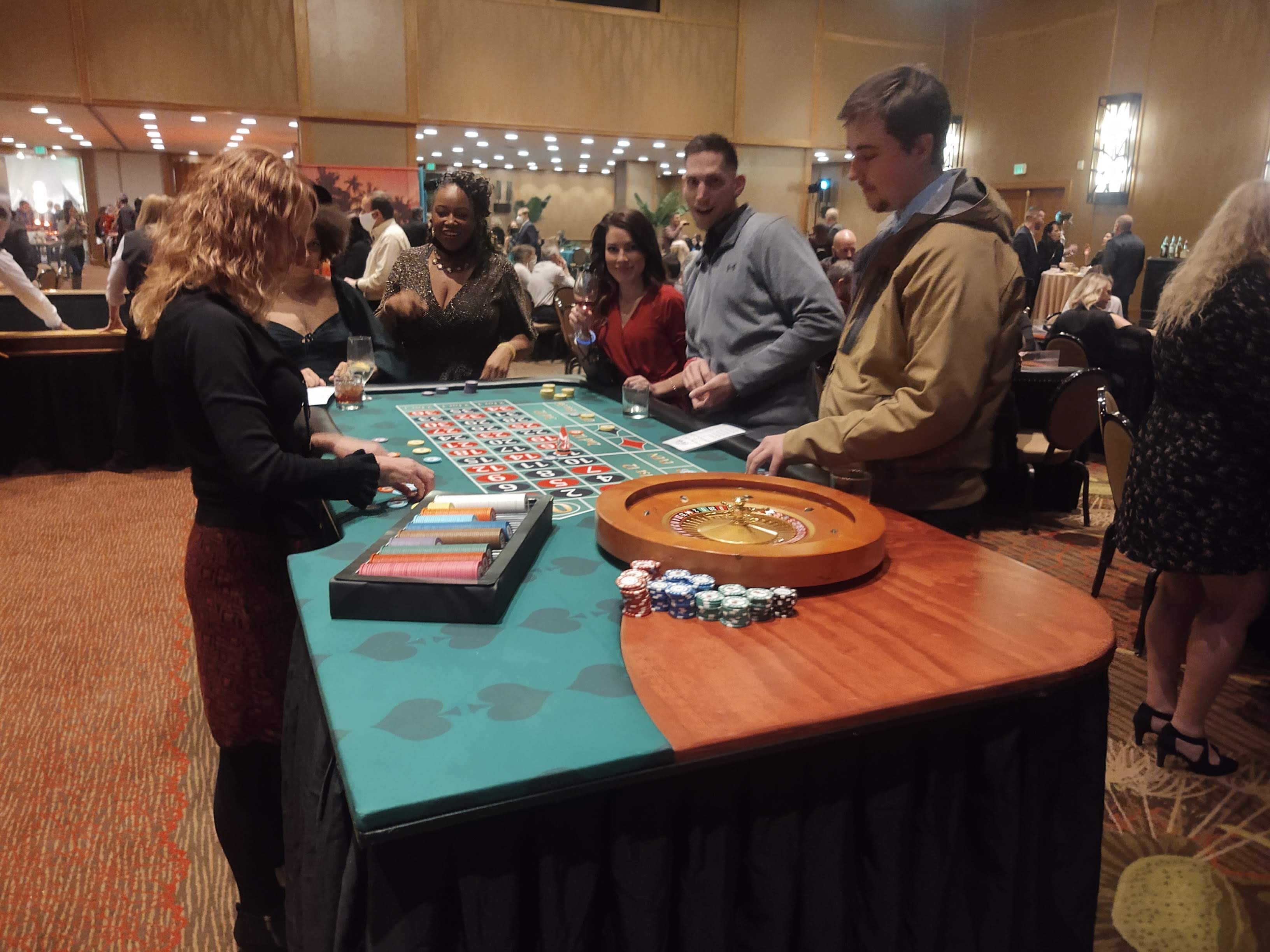 Guests playing roulette at a Tampa Casino Party USA event