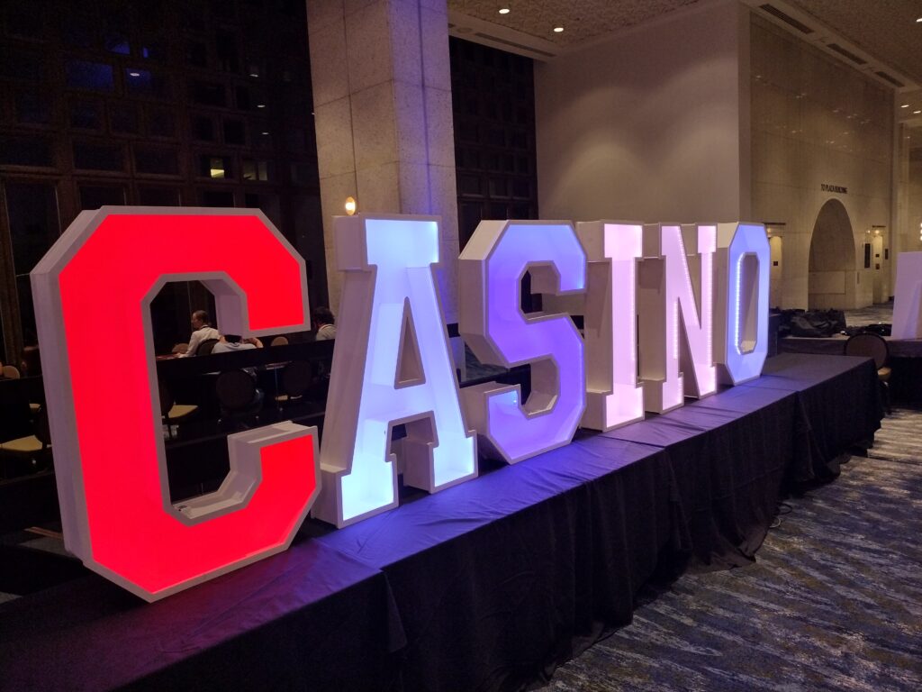 Illuminated marquee letter display at evening event